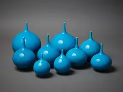Nine orb vases by Peter Collis, with turquoise glaze, sold Mar 2023