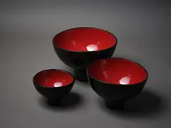 Susannah Bridges, A set of three ceramic ‘Lava’ bowls, with high-fired red interior glaze