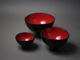 Susannah Bridges, A set of three ceramic ‘Lava’ bowls, with high-fired red interior glaze