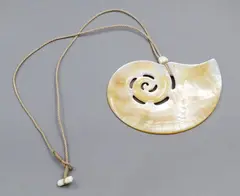 Steve Myhre, Nautilus-shaped mother-of-pearl pendant, carved & polished mother-of-pearl pendant, cord necklace