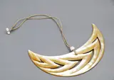 Steve Myhre, Large moon-shaped mother-of-pearl pendant, carved & polished mother-of-pearl pendant decorated with chevrons, cord necklace