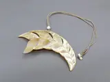 Steve Myhre, Leaf-shaped mother-of-pearl pendant, carved & polished mother-of-pearl pendant decorated with dolphin's flukes, cord necklace