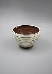 Bowl by Martin Poppelwell, glazed earthenware, sold Nov 2022