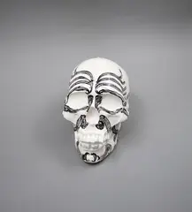 Skull by Martin Poppelwell, glazed ceramic, sold Nov 2022