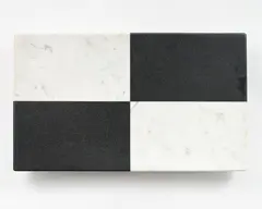 Quartered by John Edgar, black granite, white marble, 2003, sold Sep 2022
