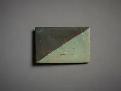 Untitled, Badge by John Edgar, mixed metal, shaped and patinated, sold Sep 2022