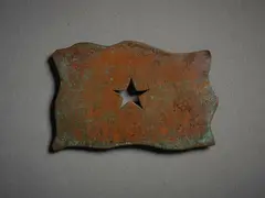Untitled, Badge by John Edgar, copper, shaped and patinated, sold Sep 2022
