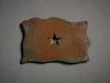 John Edgar, Untitled, Badge, copper, shaped and patinated