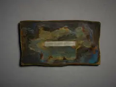 John Edgar, Untitled, Badge, mixed metal, shaped and patinated