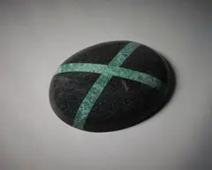 Wall Saltire (green) by John Edgar, granite, serpentine, sold Sep 2022