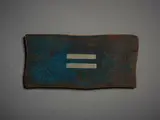 John Edgar, Untitled, Badge, mixed metal, shaped and patinated