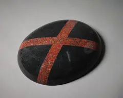 Wall Saltire (red) by John Edgar, granite, serpentine, sold Sep 2022