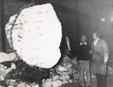 Untitled - Men with Suspended Boulder by Theodorus Johannes Schoon, gelatin silver print, sold Jun 2022