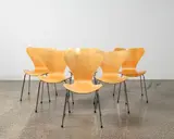 A set of six iconic and genuine Series 7 chairs by Arne Jacobsen for Fritz Hansen, originally designed in 1955, made from nine layers of pressure moulded veneer and with four tubular steel legs. This set, sold Jun 2022