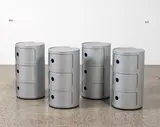 Anna Castelli for Kartell, Two Componibili units, originally designed in 1969, these examples contemporary and in silver; three units mounted together each with sliding door