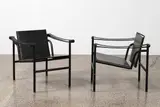 An original pair of LC1 or ‘Basculant’ chairs by Pierre Jeanneret and Charlotte Perriand Le Corbusier, originally designed in 1928, manufactured by Cassina, sold Jun 2022
