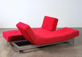 Francesco Binfare for Edra, A ‘Daumier’ chaise longue, in red wool blend fabric. Offering a bed-size flat module that can be adapted by the tilting elements for differing configurations