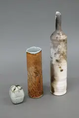 Nz Studio Pottery, Three vessels, comprising a Graham Ambrose tall bottle vase, a Warren Tippett miniature trinket box and a Diana Poor ochre vase