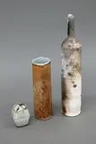 Nz Studio Pottery, Three vessels, comprising a Graham Ambrose tall bottle vase, a Warren Tippett miniature trinket box and a Diana Poor ochre vase