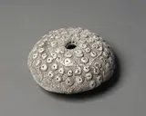 Sea Secret by Len Castle, circular domed form with sculptured top and a light ochre and blue pigments wash, a pool of alkaline glaze to the interi, sold Jun 2022
