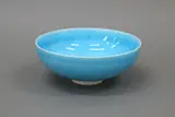 Small turquoise bowl by Len Castle, with bright crackled glaze over the white ceramic body, sold Jun 2022