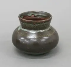 Small squat vase by Len Castle, stoneware with mottled brown and grey glazes, sold Jun 2022
