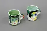 Ande Barrett-Hegan, Two coffee cups, hand-painted porcelain decorated with portraits of women