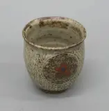 Shimaoka Tatsuzo, Stoneware yunomi, with a herring-bone impressed design and iron decorated cartouches
