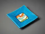 Press-moulded platter by Warren Tippett & Merilyn Wiseman, with bright blue glaze and painted gestural decoration to the centre, sold Jun 2022
