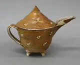Jeff Oestreicht, Sculptural teapot, wood fired salt glazed stoneware, with carved geometrical decoration on reserve, c. 1992