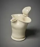 Shaped jug by Takeshi Yasuda (Japan & Uk), white earthenware with cream crackled glaze, sold Jun 2022
