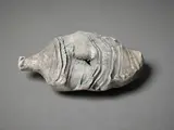Fossil bottle form by Len Castle, white earthenware with textured surface rubbed with dark umber pigment, sold Jun 2022