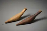 Len Castle, Rare bottle form, stoneware with dark umber pigmented surface, a band of impressed circular design around the neck, mid 1960s, fired at Tawini Road