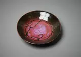 Len Castle, Stoneware dish, with gestural wax-resist decoration on tenmoku and purple glazes