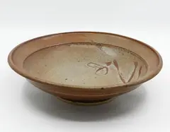 Large Bowl by Len Castle, stoneware with dark shino-type glaze and gestural wax-resist decoration, sold Jun 2022