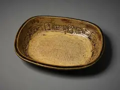 Len Castle, Large rectangular platter, ash glazed stoneware, the deep well walls impressed with various stamps, some attributed to Theo Schoon, impressed rope pattern to the centre