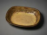 Len Castle, Large rectangular platter, ash glazed stoneware, the deep well walls impressed with various stamps, some attributed to Theo Schoon, impressed rope pattern to the centre