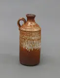 Shino glazed bottle by Len Castle, stoneware, with cylinder body and a short looping handle to the shoulder, sold Jun 2022