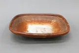 Large press-moulded platter by Len Castle, shino glazed stoneware, impressed pattern to the cavetto, sold Jun 2022