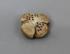 Small sedge grass holder by Len Castle, stoneware with umber pigment wash, multiple apertures to the top, sold Jun 2022