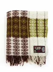 Onehunga Woollen Mills, Te Ariki travel rug, with a tukutuku panel pattern in sage green, red-brown and white