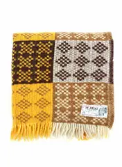 Onehunga Woollen Mills, Te Ariki travel rug, with a tukutuku panel pattern in yellow, light brown, dark brown and white