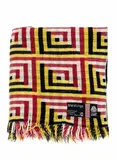 U.E.B. Textiles Ltd, Manatunga travel rug, with a tukutuku panel pattern in magenta, yellow, black, and white