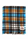 Dunedin Roslyn, Moereka Rug, with a plaid pattern in bright blue, dark and light brown, and white