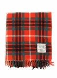 Early travel rug by Lower Hutt Daylesford Woollen Mills, with an orange, green, black, and white tartan design, sold Jun 2022
