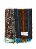 Onehunga Woollen Mills, Te Ariki travel rug, with a tukutuku panel design in brown, beige, blue, pale blue and white