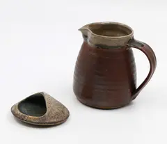 Doris Dutch, Stoneware paperweight, together with a stoneware milk jug by an unidentified potter