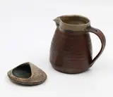 Doris Dutch, Stoneware paperweight, together with a stoneware milk jug by an unidentified potter
