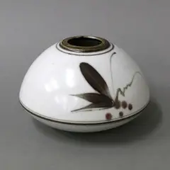 Shaped squat vase by Peter Collis, glazed and painted ceramic decorated with stylised leaf and berry motif on white ground, sold Apr 2022