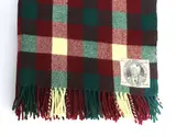 Early travel rug by Christchurch Kaiapoi Woollen Co., decorated with a tartan design in red, green and cream, sold Nov 2021